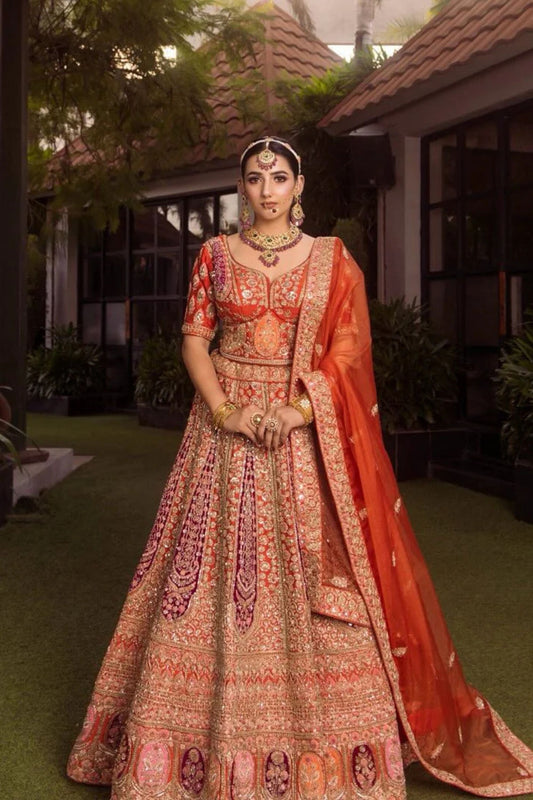 Rusty Orange Bridal Lehenga with Hand Stitched Workmanship  Paired with Crop Top and Dupatta