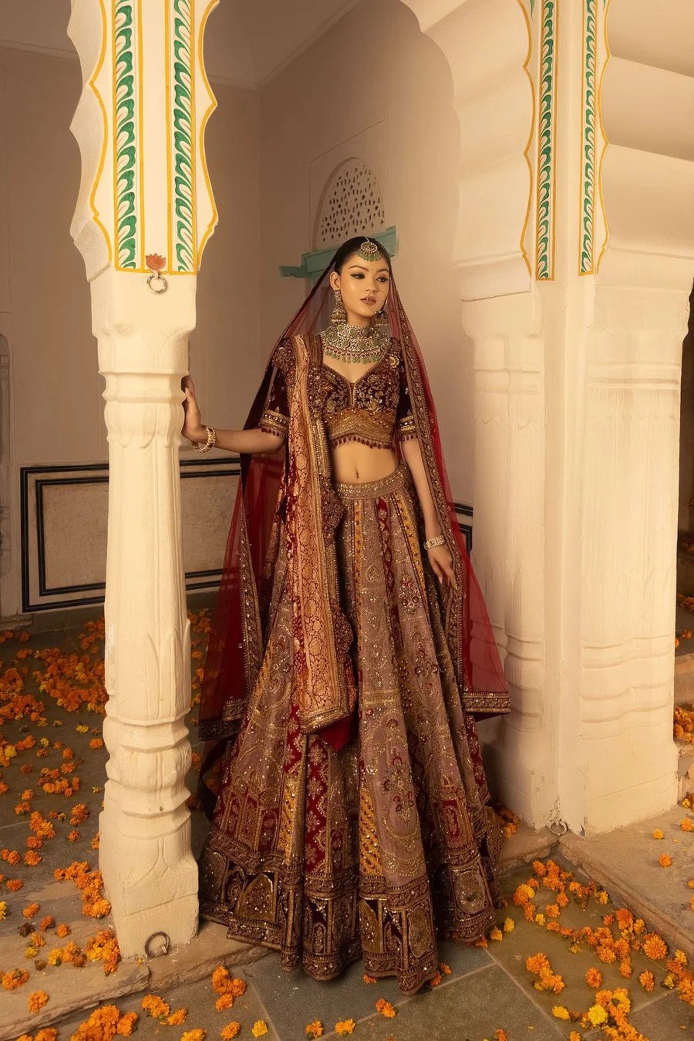 Multi Hued Flairy Bridal Lehenga Luxuriously Paired with Blouse, Dupatta and Bandhani Odhani.