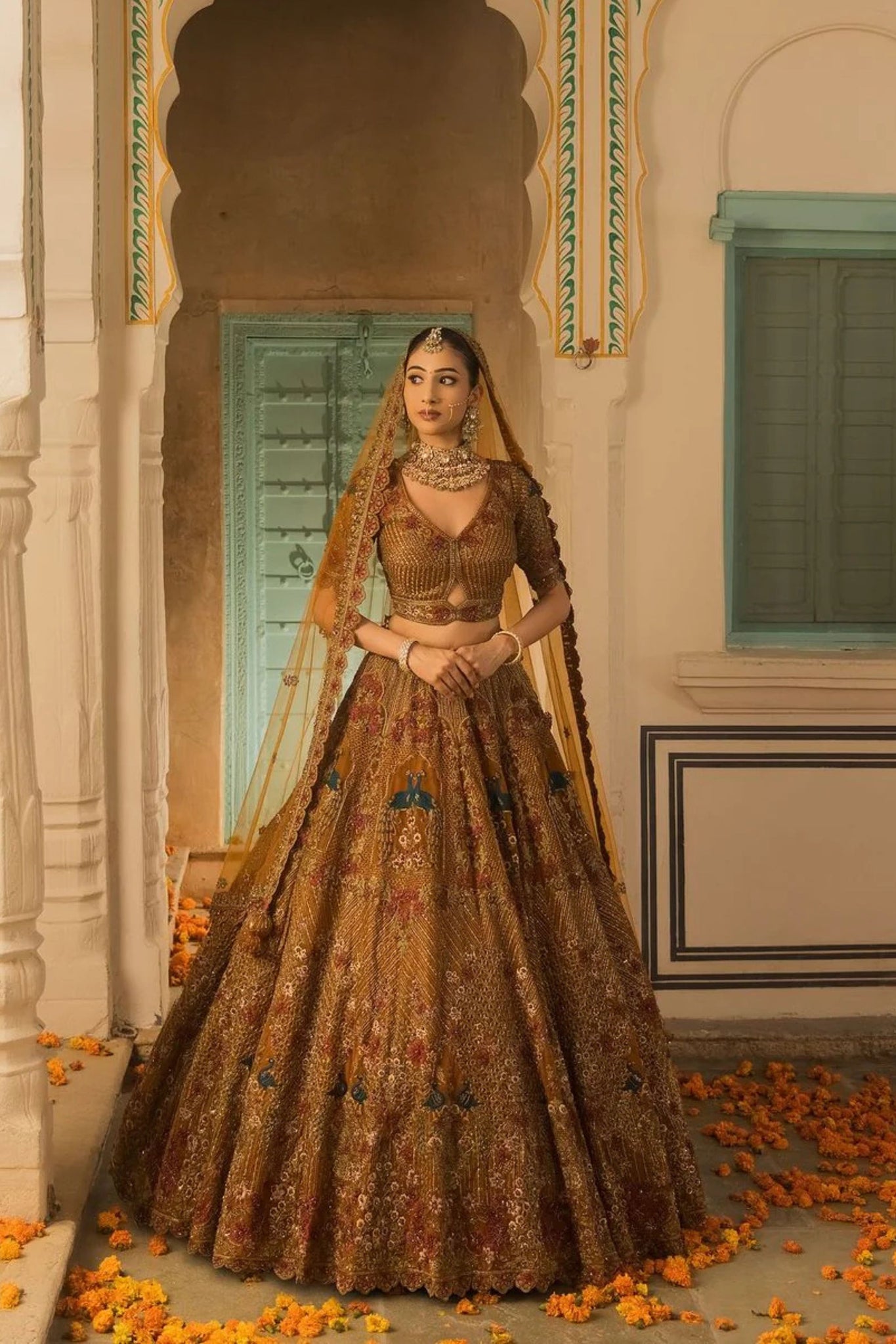 A Soft Mustard Hued Ball Bridal lehenga Paired with a Crop Top and Dupatta