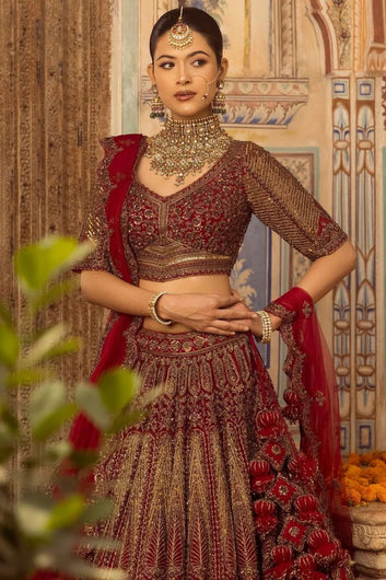 Cherry maroon bridal lehenga with handcrafted embroidery and scalloped dupatta