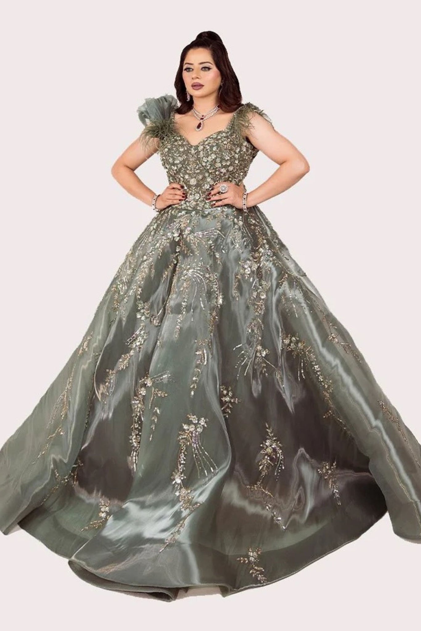 Metal Green Engagement Gown with Hand Stitched Details, Feathered Shoulders and Elegant Flare