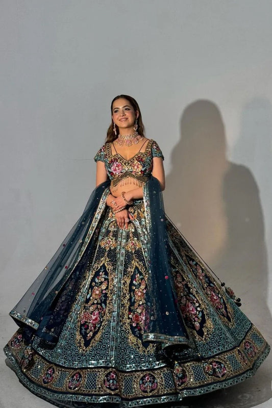 Flairy Dark Blue Hued Heavy Lehenga Paired with an Elegant Top and Dupatta