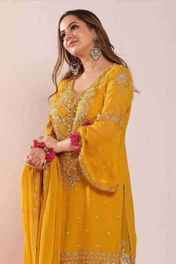 Bright mustard shaded Pakistani garara suit with dupatta