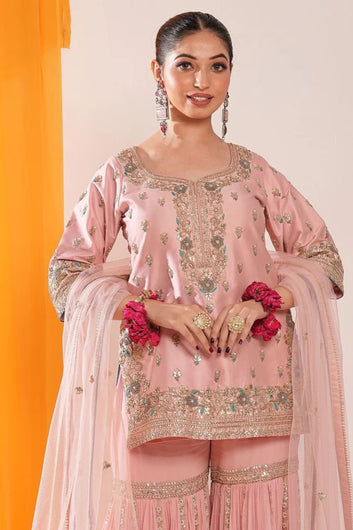 Powder peach hued embroided garara suit with dupatta