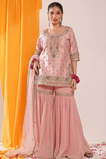 Powder peach hued embroided garara suit with dupatta