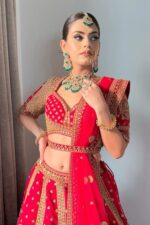 Coral Pink Bridal Lehenga with Golden Embroidery