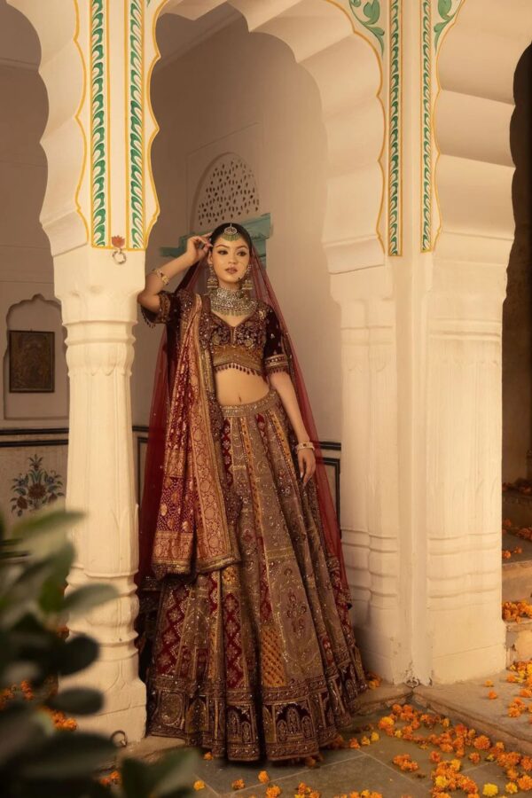 Multi Hued Flairy Bridal Lehenga Luxuriously Paired with Blouse, Dupatta and Bandhani Odhani.