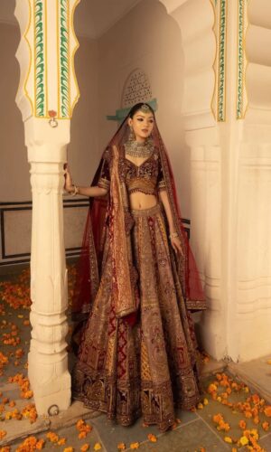 Multi Hued Flairy Bridal Lehenga Luxuriously Paired with Blouse, Dupatta and Bandhani Odhani.