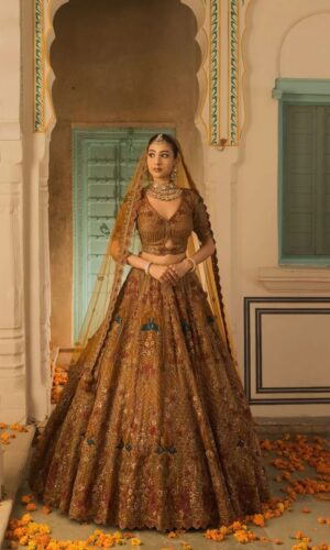 A Soft Mustard Hued Ball Bridal lehenga Paired with a Crop Top and Dupatta