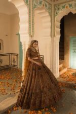 A Soft Mustard Hued Ball Bridal lehenga Paired with a Crop Top and Dupatta