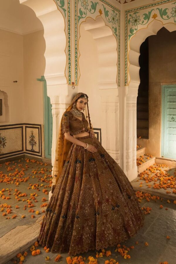 A Soft Mustard Hued Ball Bridal lehenga Paired with a Crop Top and Dupatta