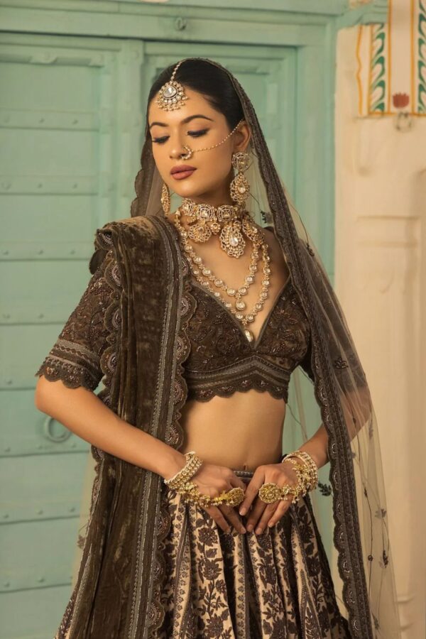 Ivory and Mehendi Hued Bridal lehenga with Resham Work Paired with Micro Blouse, Odhani and Bubble Net Dupatta.