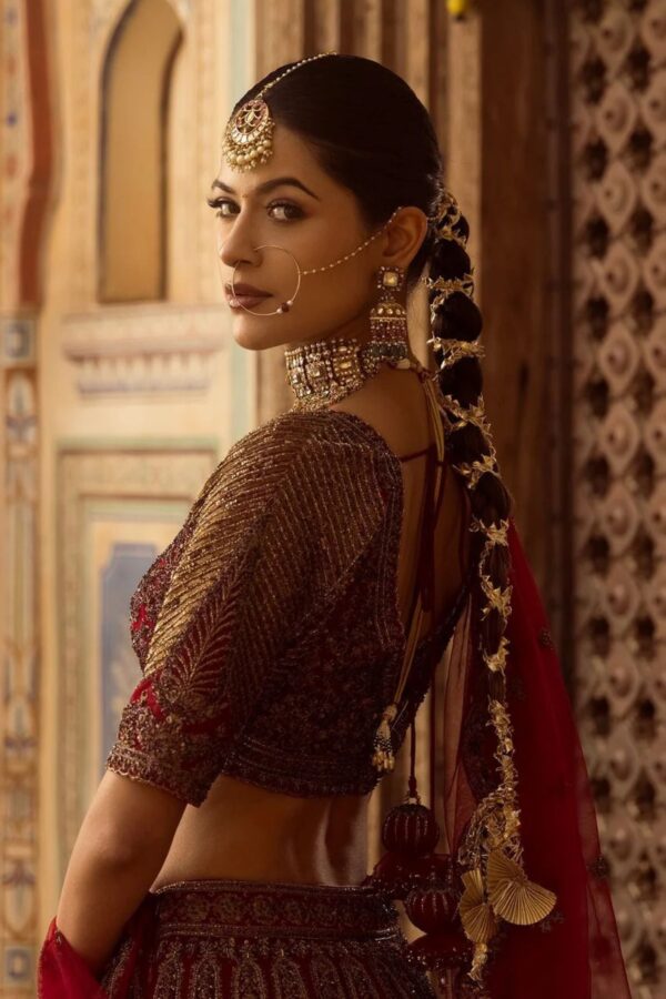Cherry maroon bridal lehenga with handcrafted embroidery and scalloped dupatta
