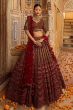 Cherry maroon bridal lehenga with handcrafted embroidery and scalloped dupatta