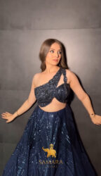 Dark blue shaded flairy lehenga with off shoulder top