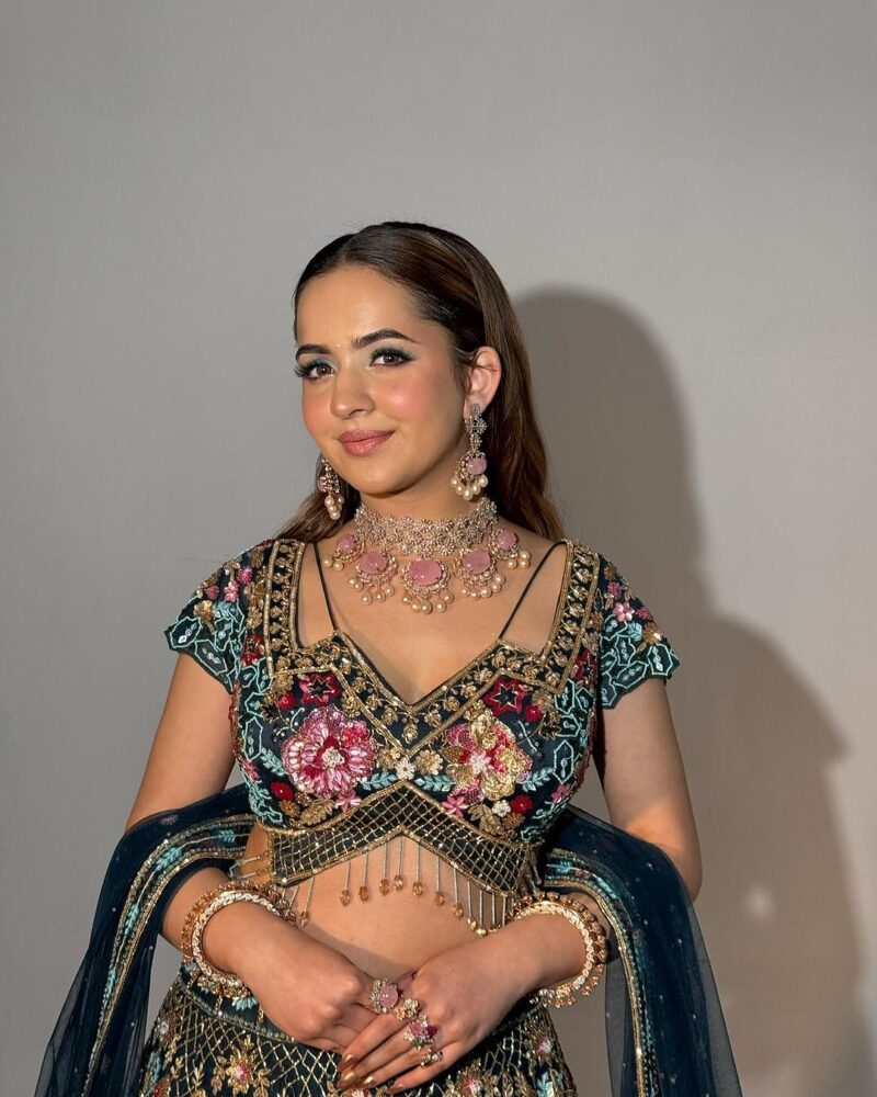 Flairy Dark Blue Hued Heavy Lehenga Paired with an Elegant Top and Dupatta