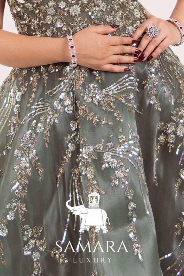 Metal Green Engagement Gown with Hand Stitched Details, Feathered Shoulders and Elegant Flare