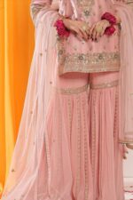 Powder peach hued embroided garara suit with dupatta