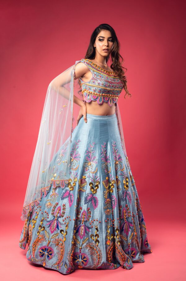 Sky Blue Boat Neck Lehenga with Matching Blouse and Net Dupatta.