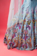 Sky Blue Boat Neck Lehenga with Matching Blouse and Net Dupatta.