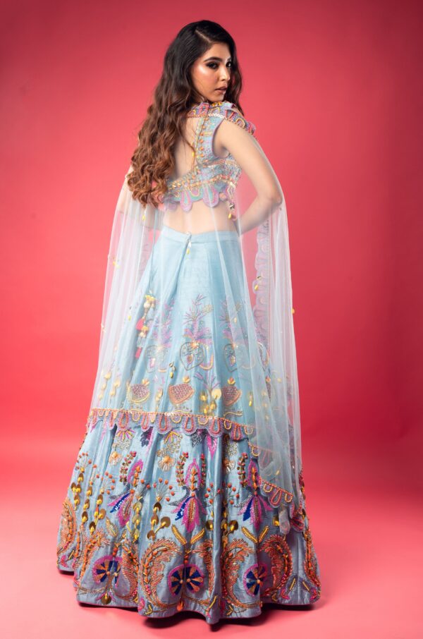 Sky Blue Boat Neck Lehenga with Matching Blouse and Net Dupatta.