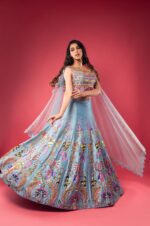 Sky Blue Boat Neck Lehenga with Matching Blouse and Net Dupatta.